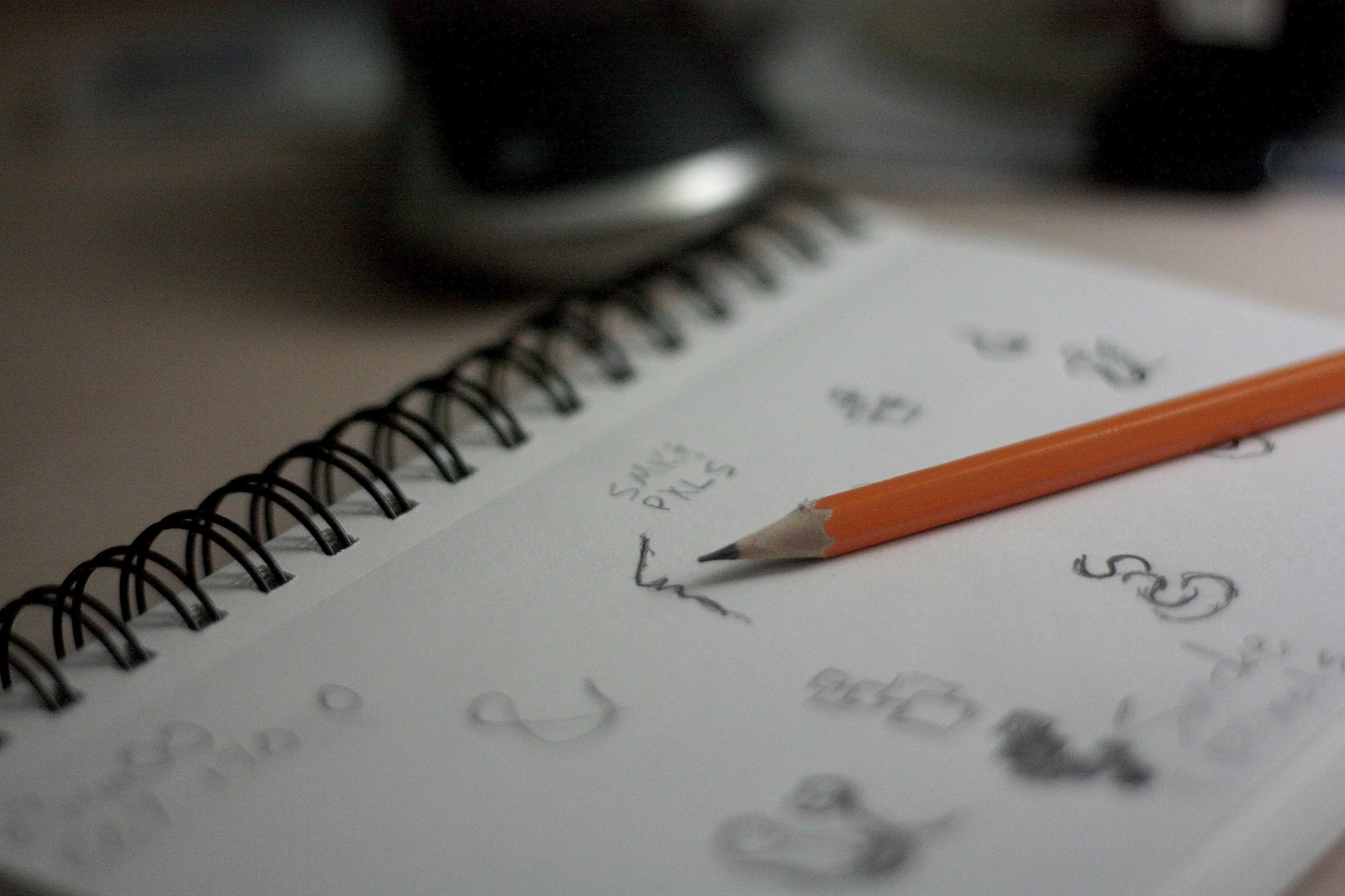 rough ideas sketched on notebook with pencil